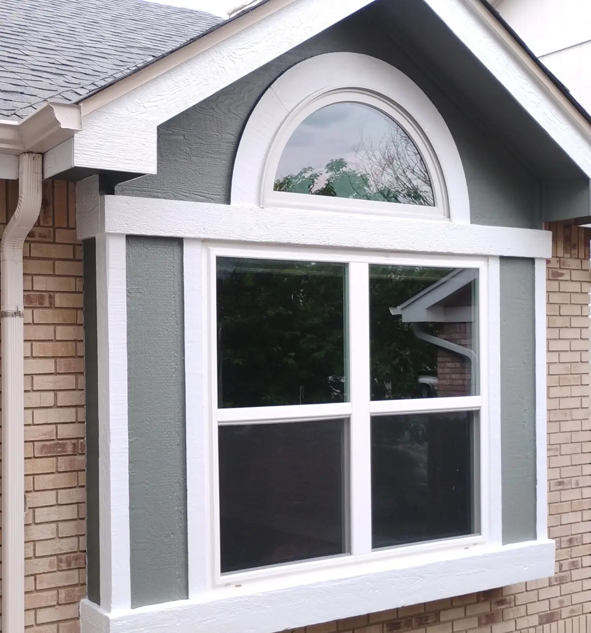Window with white trim on a brick home in Colorado Springs